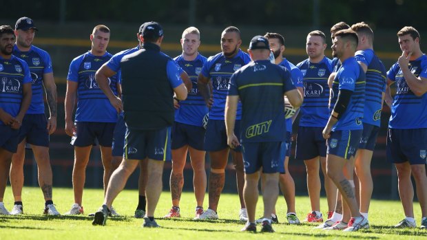 Hands up, who's available?: 2016 City Origin players look on as current coach Brad Fittler addresses the squad.