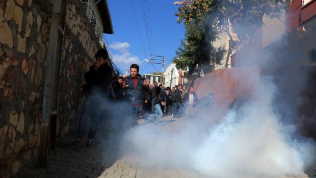 Riot police use teargas to push back pro-Kurdish politicians as security forces clash with Kurdistan Workers' Party, or PKK.