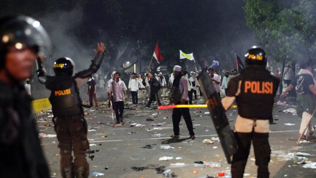 Police during the rally against Ahok in Jakarta. 