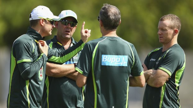 Faces of concern: Chris Rogers with team doctor Peter Brukner, Michael Clarke and Darren Lehmann.
