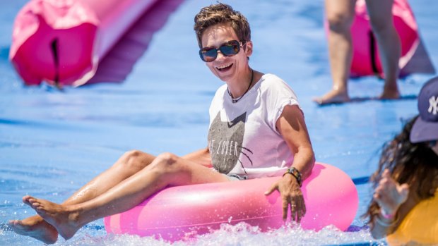 Leanne Kruse of Coburg cools off in a temporary waterslide at Federation Square.