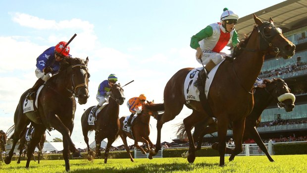 Red-letter day: Damian Lane races clear on Jon Snow to win the Australian Derby.