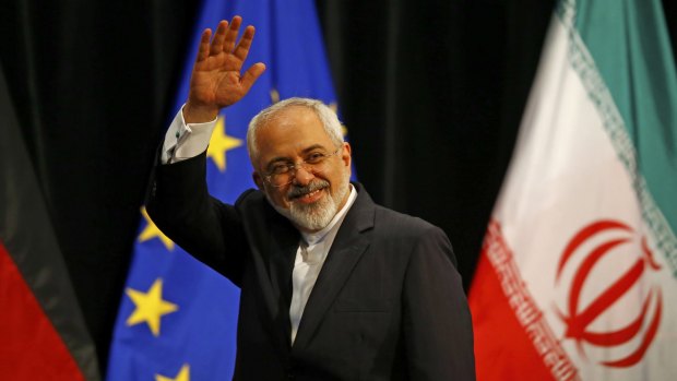 Iranian Foreign Minister Mohammad Javad Zarif waves after Iran and six major world powers reached a nuclear deal on Tuesday, capping more than a decade of negotiations.