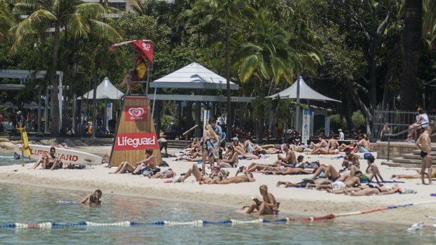 Scorcher: Hundreds of tourists and Brisbane locals spend their G20 public holiday at Streets Beach on Brisbane's South Bank.