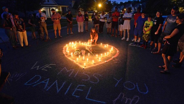 Friends and family of Daniel Harris gather during a candlelight vigil to remember Harris, a deaf motorist who was shot and killed by a state trooper in North Carolina.