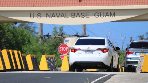 Cars enter Naval Base Guam near Hagatna, Guam. 