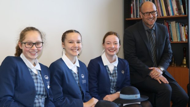 IB students, from left, Alexandra Doubleday, Kate Addison and Sophia Kennaugh with Tara's head of Senior School Scott Baker.