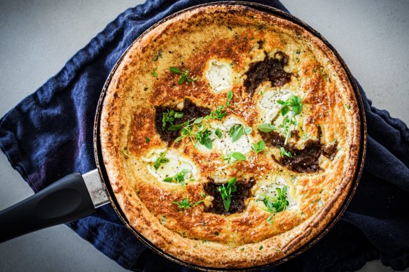 Dutch baby pancake dolloped with onion jam and goat's cheese (recipe below).