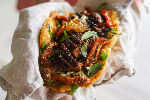 Flatbread piled with coffee spice-rubbed lamb, honey and feta and optional fresh honeycomb.