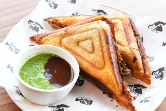 Paneer tikka jaffle with mint and tamarind chutney.