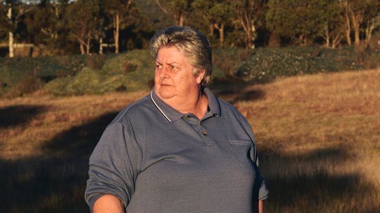 Bywong resident Denise Hudson is unhappy about the glass near the Federal Highway