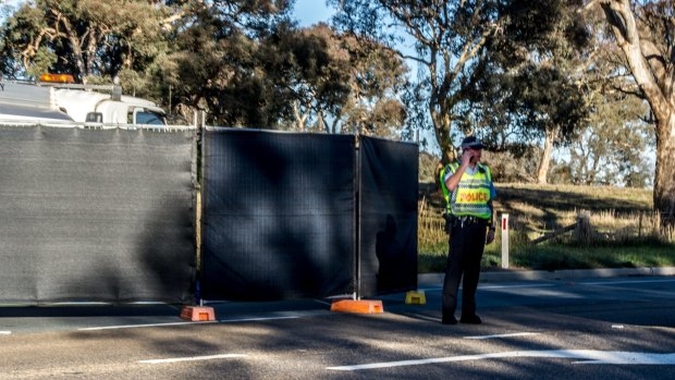 ACT policing control the scene where a truck driver died on Pialligo Avenue near Canberra Airport after a medical episode. 