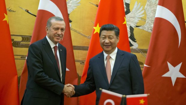 Turkish President Recep Tayyip Erdogan (left) shakes hands with Chinese President Xi Jinping in Beijing on Wednesday.