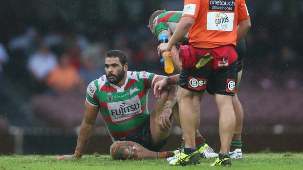 Wounded: Greg Inglis hits the deck again.