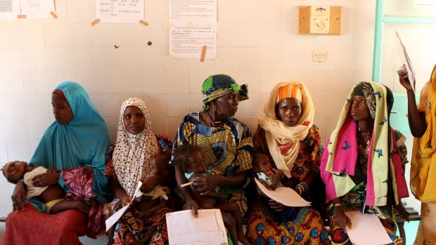 Mothers with their malnourished children wait for the doctor at the Maine Soroa Stablisation Centre in the hospital in Niger in 2012.