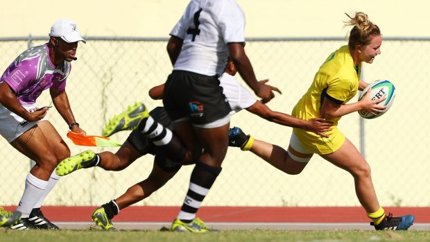 Lilly-Rose Bennett of Australia scores a try during the match between Fiji and Australia in the Girls Rugby Sevens.