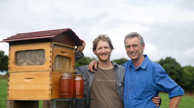 Cedar, left, and Stuart Anderson with their invention, the flow hive, near Byron Bay.