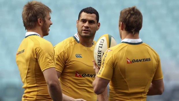 The three most likely: Drew Mitchell, George Smith and Matt Giteau converse ahead of a Wallabies Test in 2009.