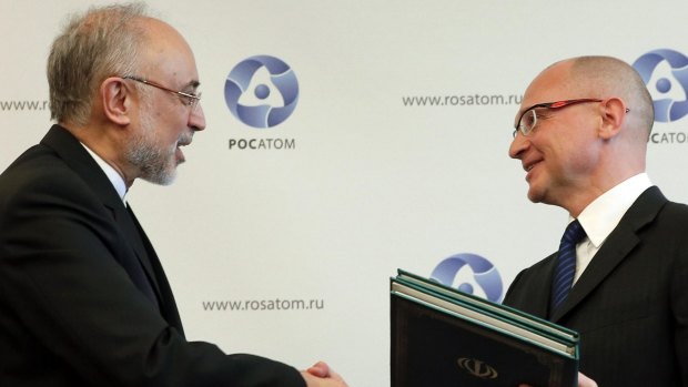 Sergei Kiriyenko (right), head of the Russian state nuclear monopoly Rosatom, and head of Iran's Atomic Energy Organisation Ali Akbar Salehi shake hands during a signing ceremony in Moscow.