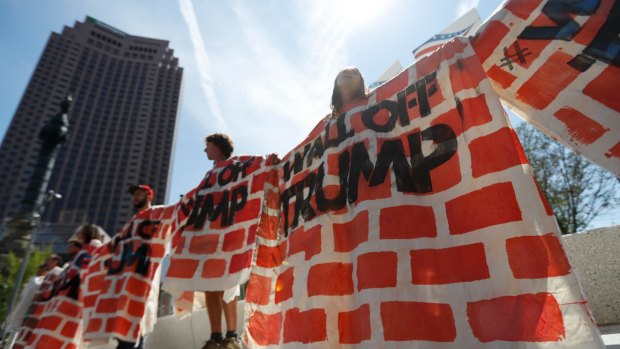 Activists protested at the Republican convention in Cleveland over Donald Trump's plans for a wall along the US-Mexican border.