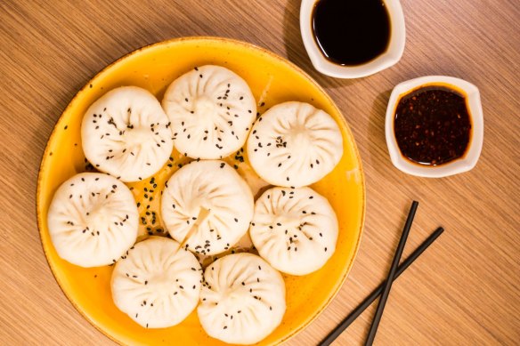 Pan-fried dumplings with black rice vinegar are big, thick-skinned and pork-filled.