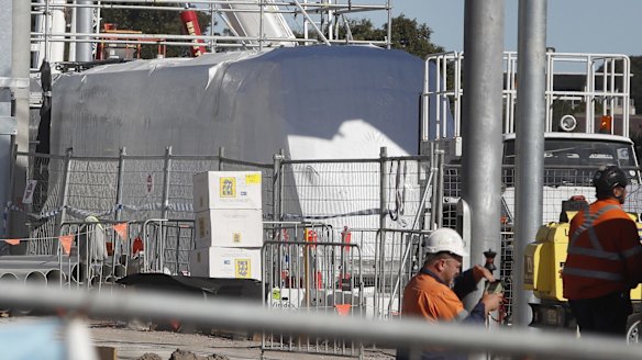 A tram is seen covered in plastic at Randwick Racecourse station construction site in Sydney.