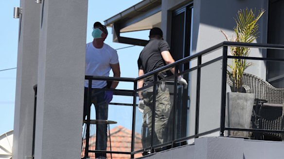 Police raid a home in Merrylands on Thursday.