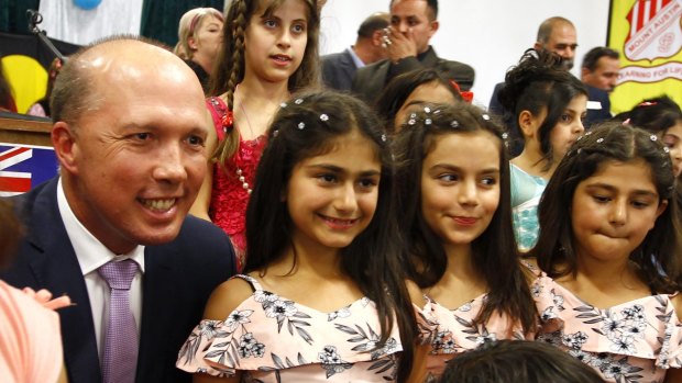 Dutton with Dima Hamkna, 10, Natalie Mirza, 10 and Cassandra Mirza, 9, at Wagga Wagga. 