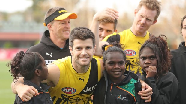 Damien Hardwick, Trent Cotchin and Jack Riewoldt with children from the Melbourne Indigenous Transition School.