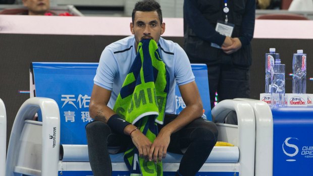 Nick Kyrgios rests during a break in the men's singles final match against Rafael Nadal.