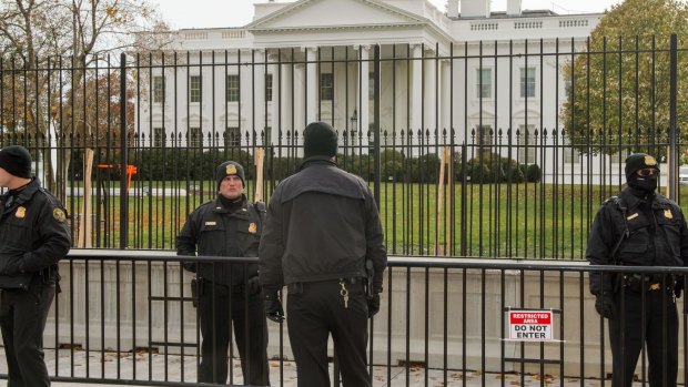 Arrest: Members of the Uniformed Division of the US Secret Service  on duty in front of the White House.