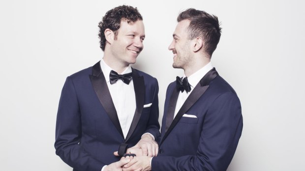 Husband and husband: Joel Meares and his partner Kyle in their wedding suits. 