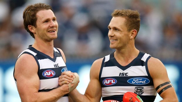 Cats Patrick Dangerfield (left) and Joel Selwood celebrate their win.