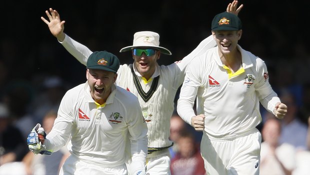 Australia's Peter Nevill, Michael Clarke and Adam Voges celebrate taking the wicket of England wicketkeeper Jos Buttler at Lord's on Sunday.