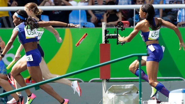 English Gardner and Allyson Felix, right, drop the baton in their heat.