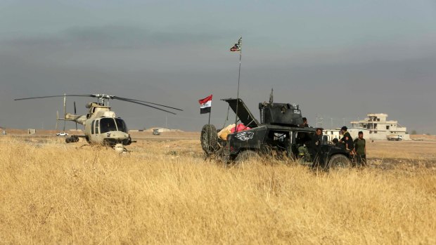 An Iraqi military helicopter makes emergency landing outside Mosul.