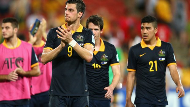 Not satisfied: Tomi Juric and the Socceroos walk off Suncorp Stadium after their loss to South Korea