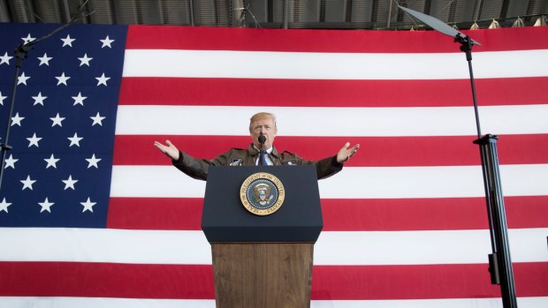 President Donald Trump speaks at a hanger rally at Yokota Air Base in Japan on Sunday.