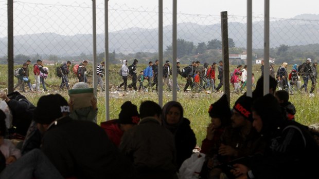 People arrive at the transit camp for refugees near the southern Macedonian town of Gevgelija, after crossing the border from Greece on Thursday.