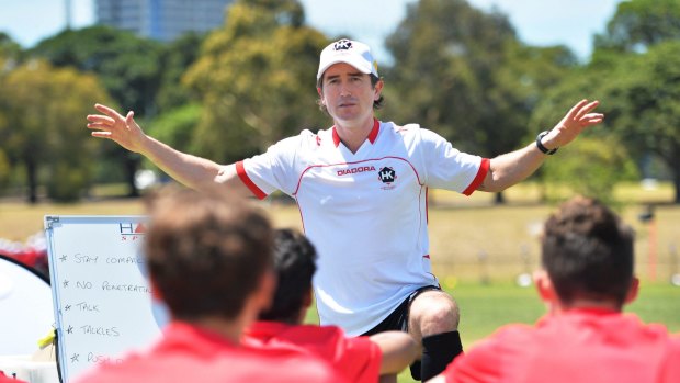 Park life: Harry Kewell guides youngsters in a session at  Albert Park. 