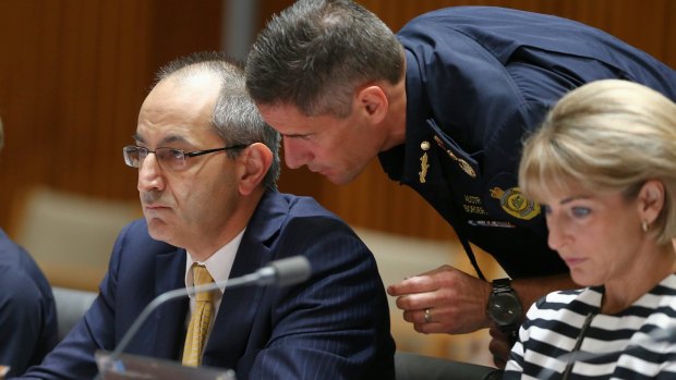 Secretary of the Department of Immigration and Border Protection Michael Pezzullo and Australian Border Force Commissioner Roman Quaedvlieg in discussion during estimates.