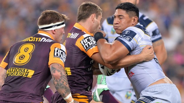 Epic clash: Jason Taumalolo of the Cowboys attempts to break the Brisbane defence.