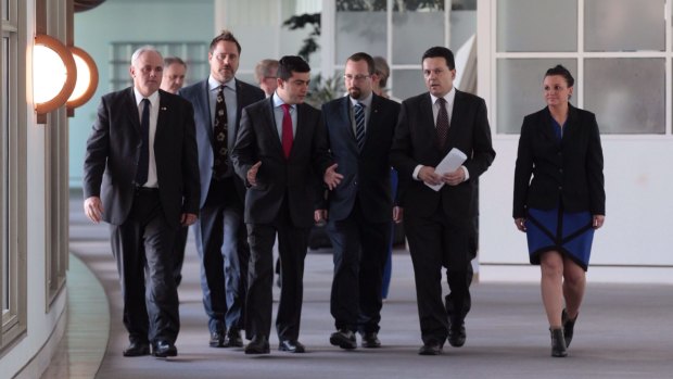 Jacqui Lambie and fellow senators gather at Parliament House to announce their move.