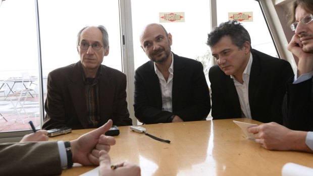 Editor in chief of French satirical weekly Charlie Hebdo Gerard Briard, lawyer of Charlie Hebdo Richard Malka and French columnist for Charlie Hebdo Patrick Pelloux speak to the press at the headquarters of French newspaper <i>Liberation</i>.