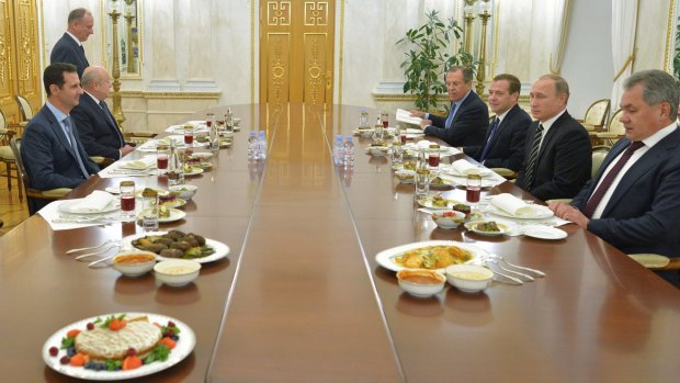 Syrian President Bashar al-Assad (left) dines with Russian President Vladimir Putin, Foreign Minister Sergey Lavrov, Prime Minister Dmitry Medvedev and Defence Minister Sergei Shoigu.