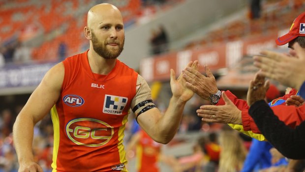 Gary Ablett celebrates the Suns' victory over North Melbourne.