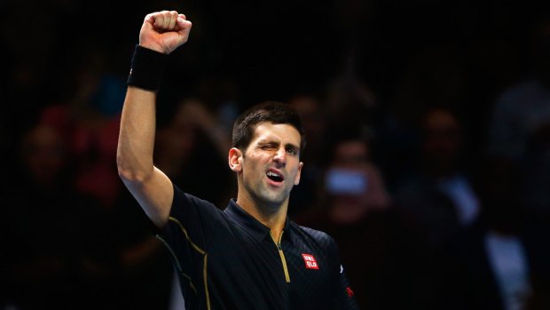 Novak Djokovic celebrates beating Kei Nishikori.