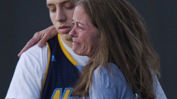 Jacob Stevens, 18, hugs his mother Tammi Stevens, after a gunman open fire in a local cinema, in Aurora, Colorado, killing 12, in 2012.