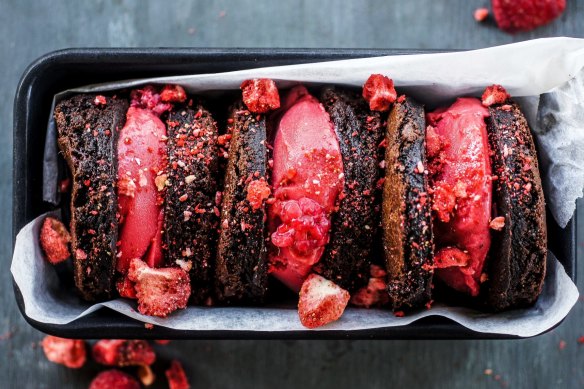 Brownie rounds sandwiching raspberry sorbet.