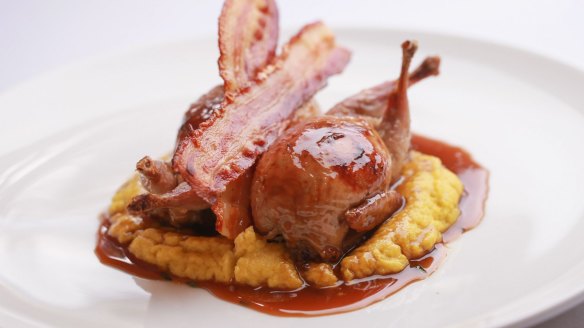 Sage-stuffed quail with bacon and jus.